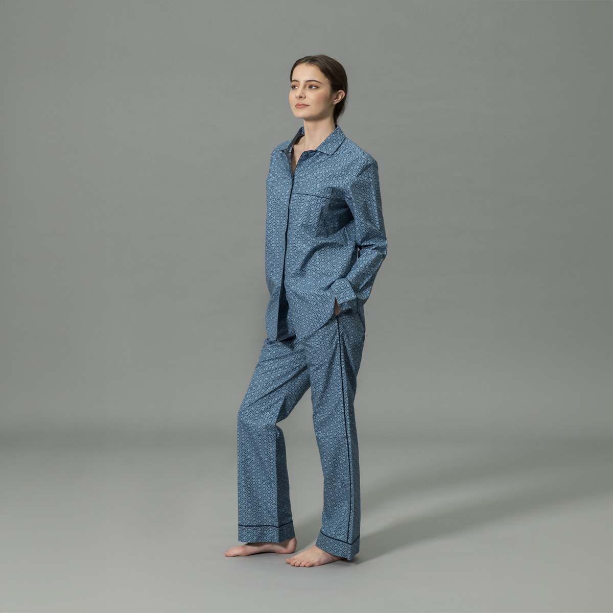 Side View of Model Wearing Matouk Luca Pajama Set in Levi Prussian Blue