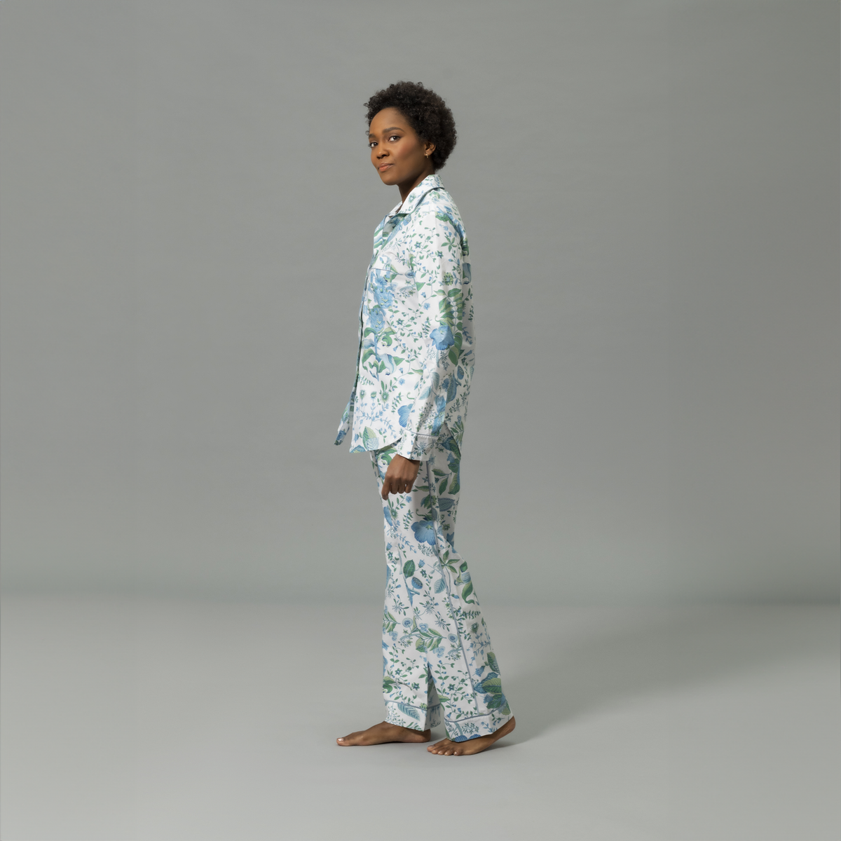 Side View of Model Wearing Matouk Luca Pajama Set in Pomegranate Sea