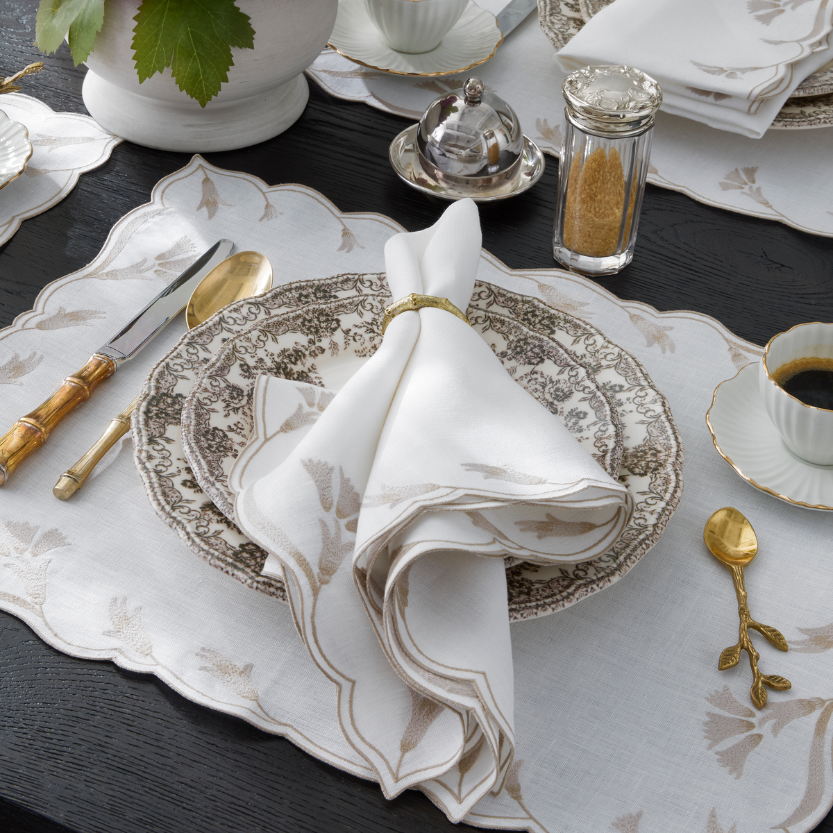 Table neatly arranged with Matouk Marcella Table Linens in Dune color