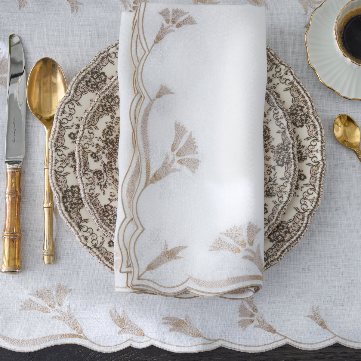 Dune Matouk Marcella Table Linens Highlighting its scalloped edges