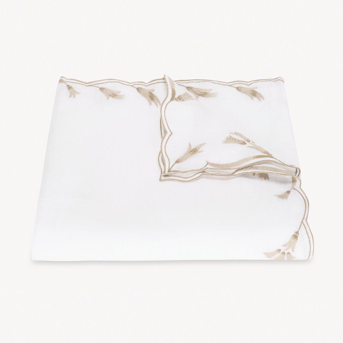 Folded Tablecloth of Matouk Marcella Table Linens in Dune color