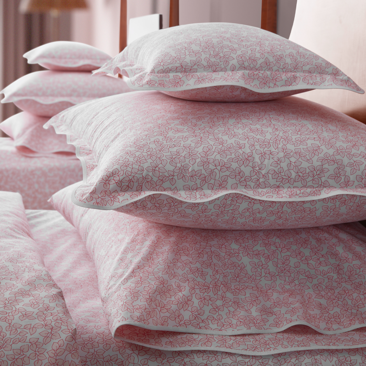 Closeup of Shams and Pillowcases Stacked of Matouk Margot Bedding in Blush Color