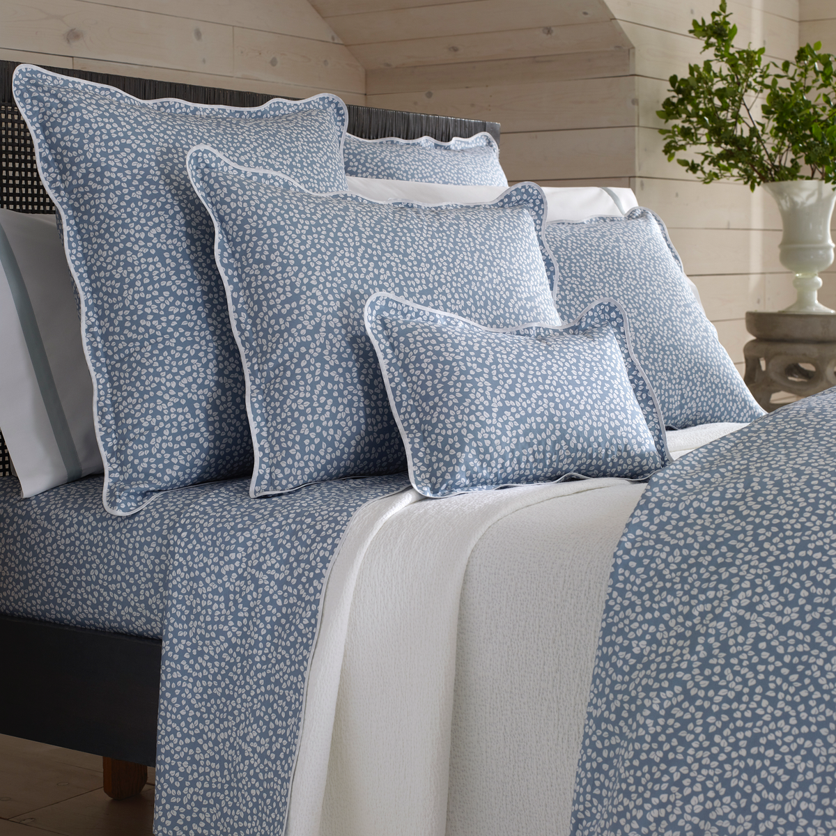 Closeup of Shams and Pillowcases Stacked of Matouk Margot Bedding in Hazy Blue Reverse Color