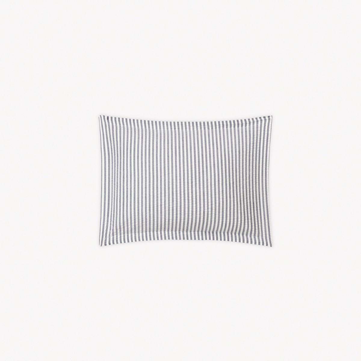 A Boudoir Sham in Deepnavy stripes, inspired by cotton seersucker bedding from the Matouk Matteo Collection