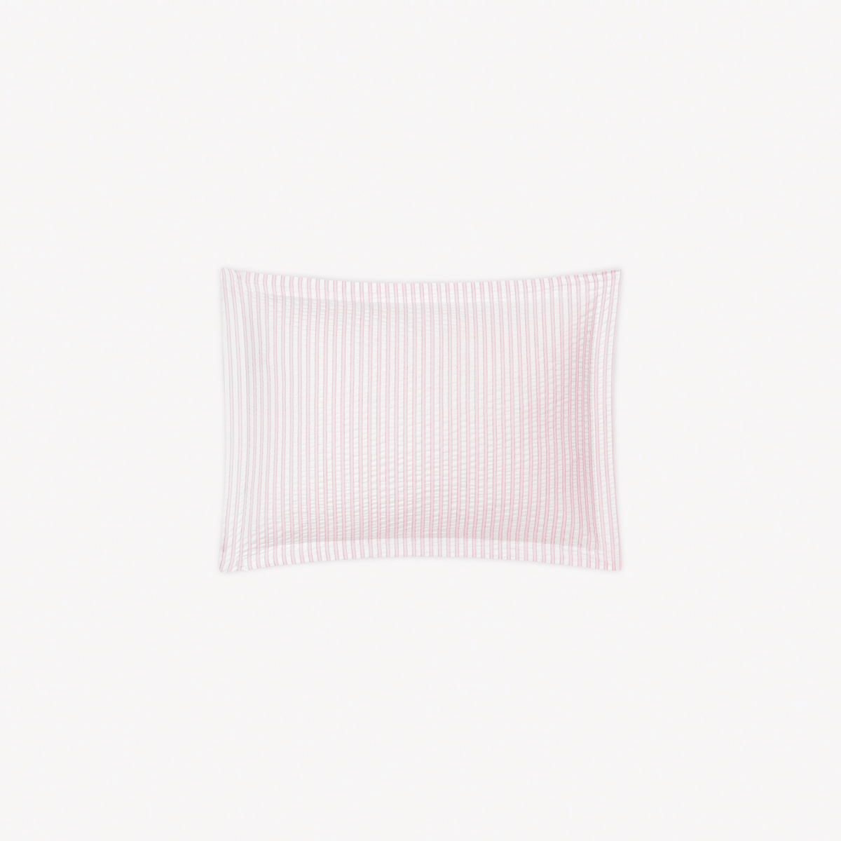 A Boudoir Sham in Pink stripes, inspired by cotton seersucker bedding from the Matouk Matteo Collection