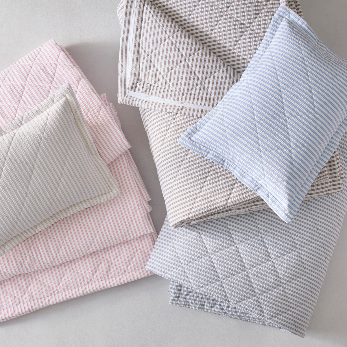 Folded cotton seersucker bedding with in 2026 colors and is part of Matouk Matteo Bedding