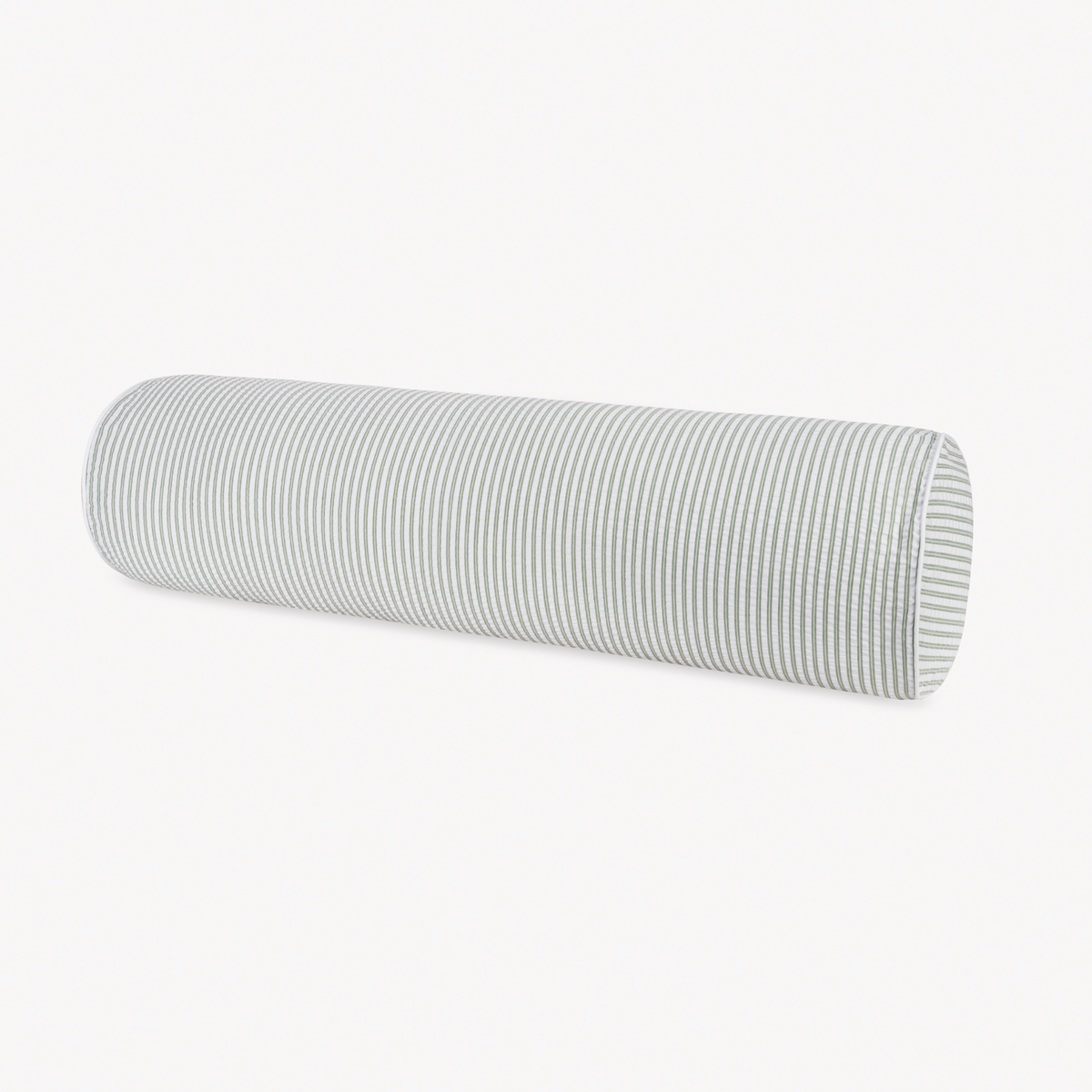 A cylindrical pillow in cotton seersucker bedding from the Matouk Matteo Collection, with light gray and white stripes.