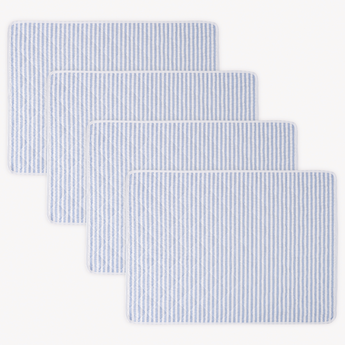 Four rectangular 100% cotton Matouk Matteo Placemats in Azure color