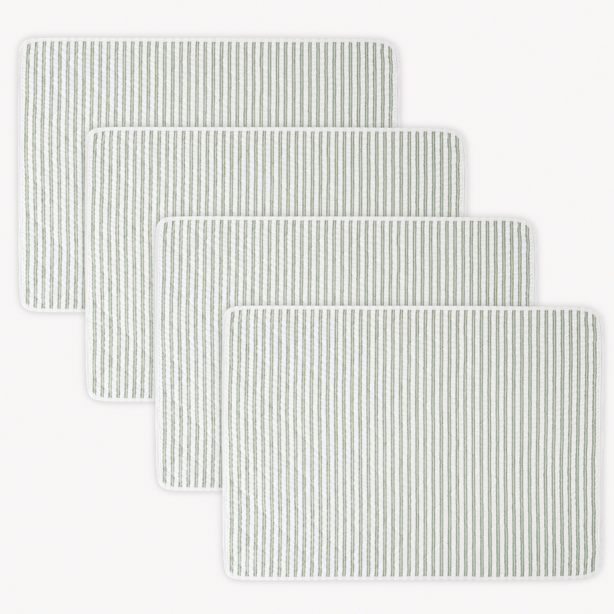 Four rectangular 100% cotton Matouk Matteo Placemats in Palm color