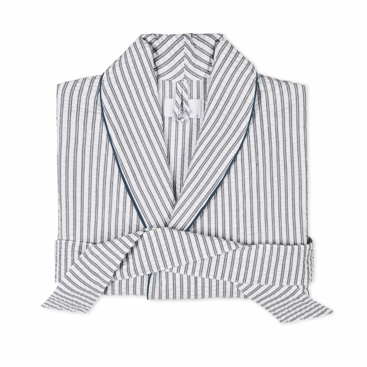 A folded seersucker Matouk Matteo Robe in Deep Navy color