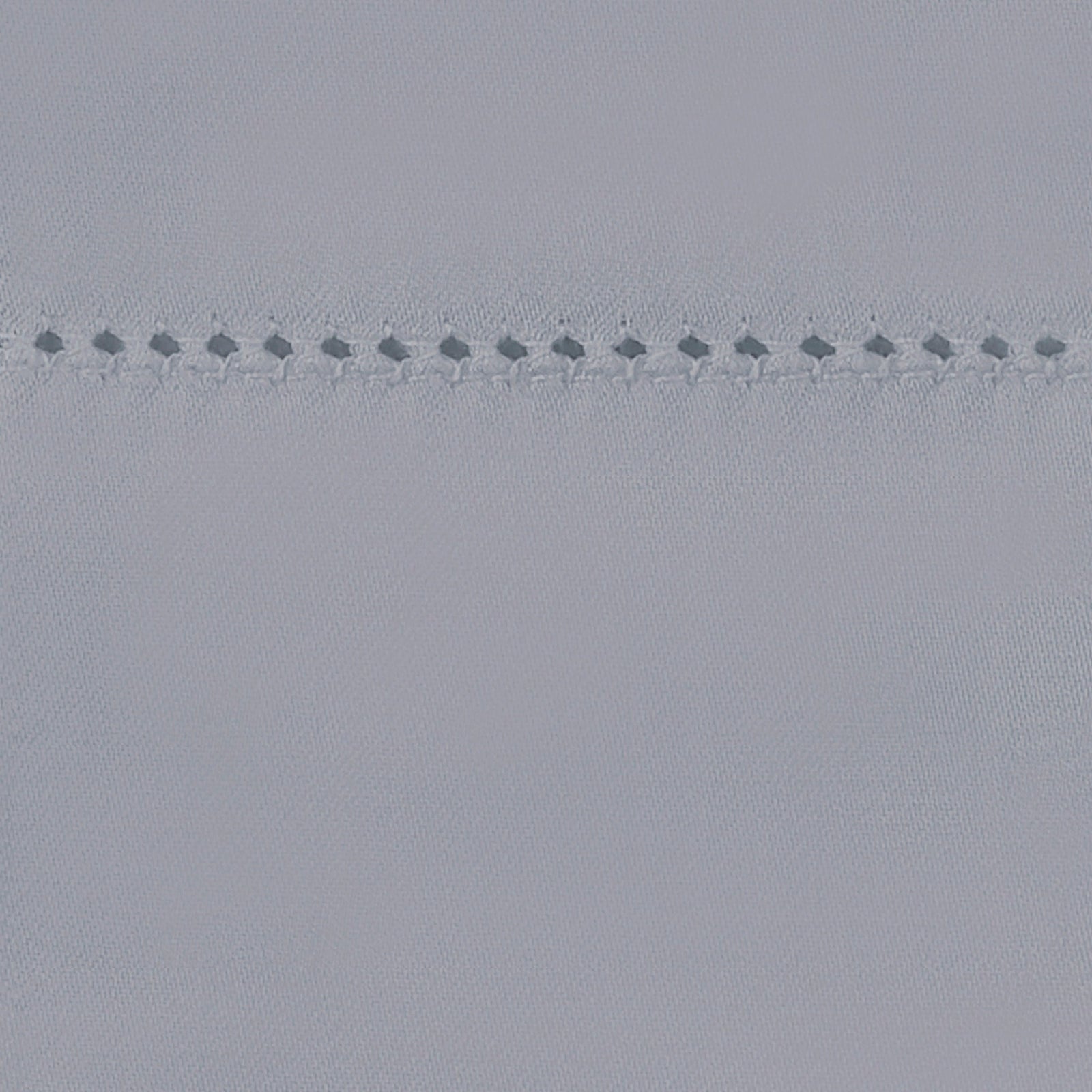 Bed Dressed in Matouk Milano Hemstitch Bedding with Swatch in Color Elephant