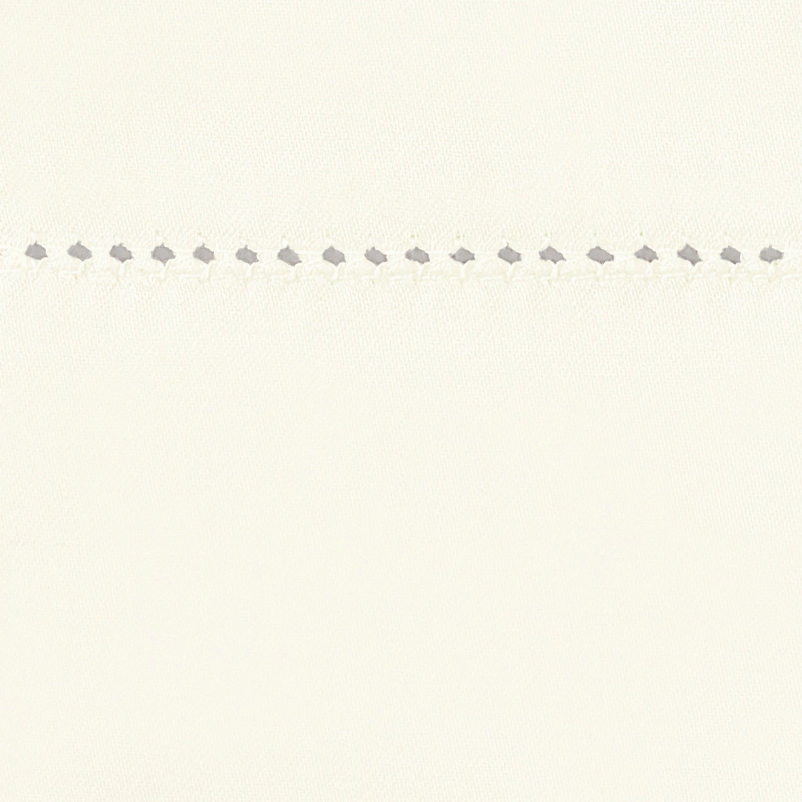 Bed Dressed in Matouk Milano Hemstitch Bedding with Swatch in Color Ivory