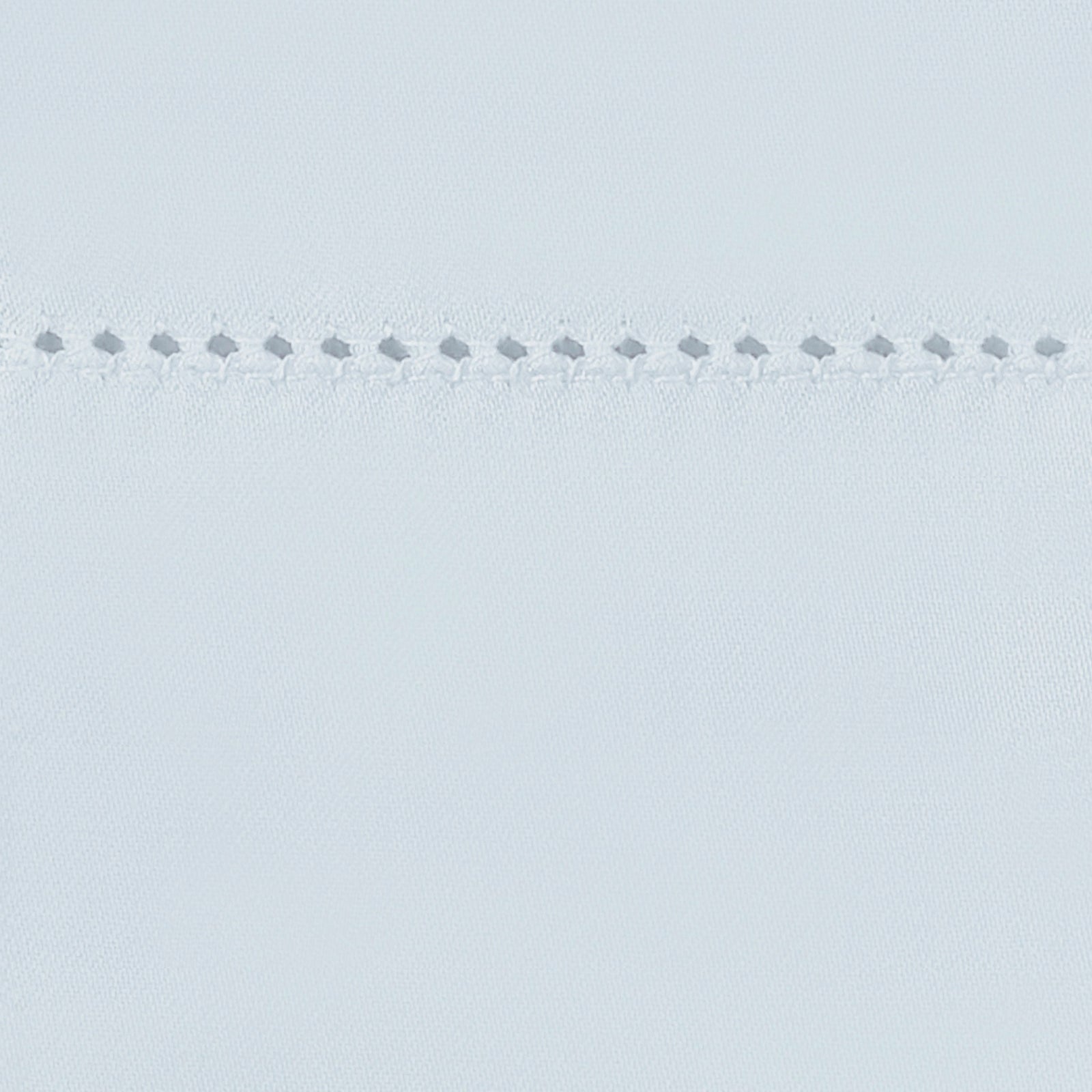 Bed Dressed in Matouk Milano Hemstitch Bedding with Swatch in Color Pool