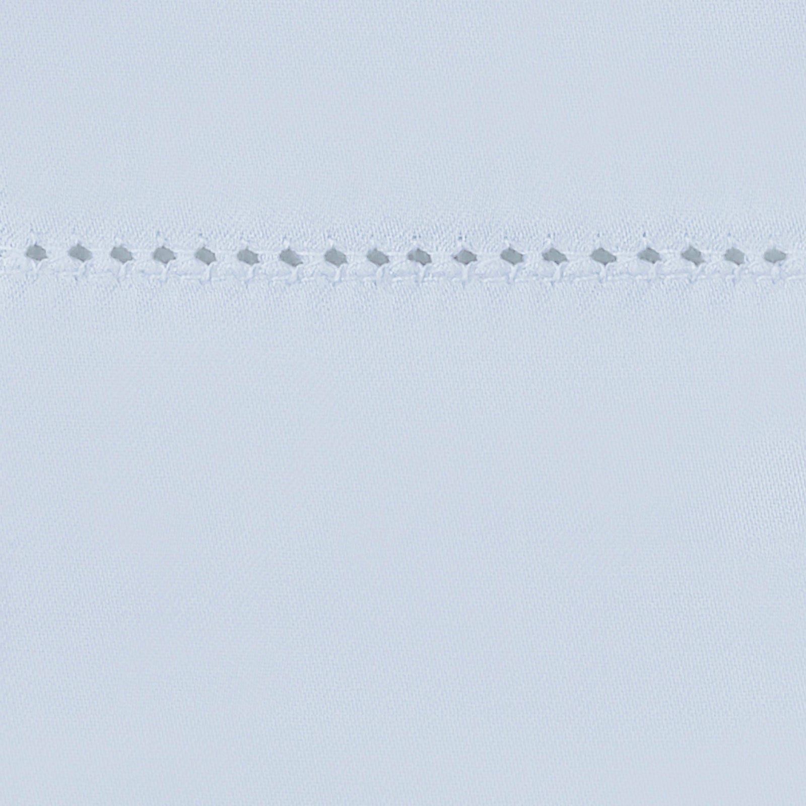 Bed Dressed in Matouk Milano Hemstitch Bedding with Swatch in Color Sky