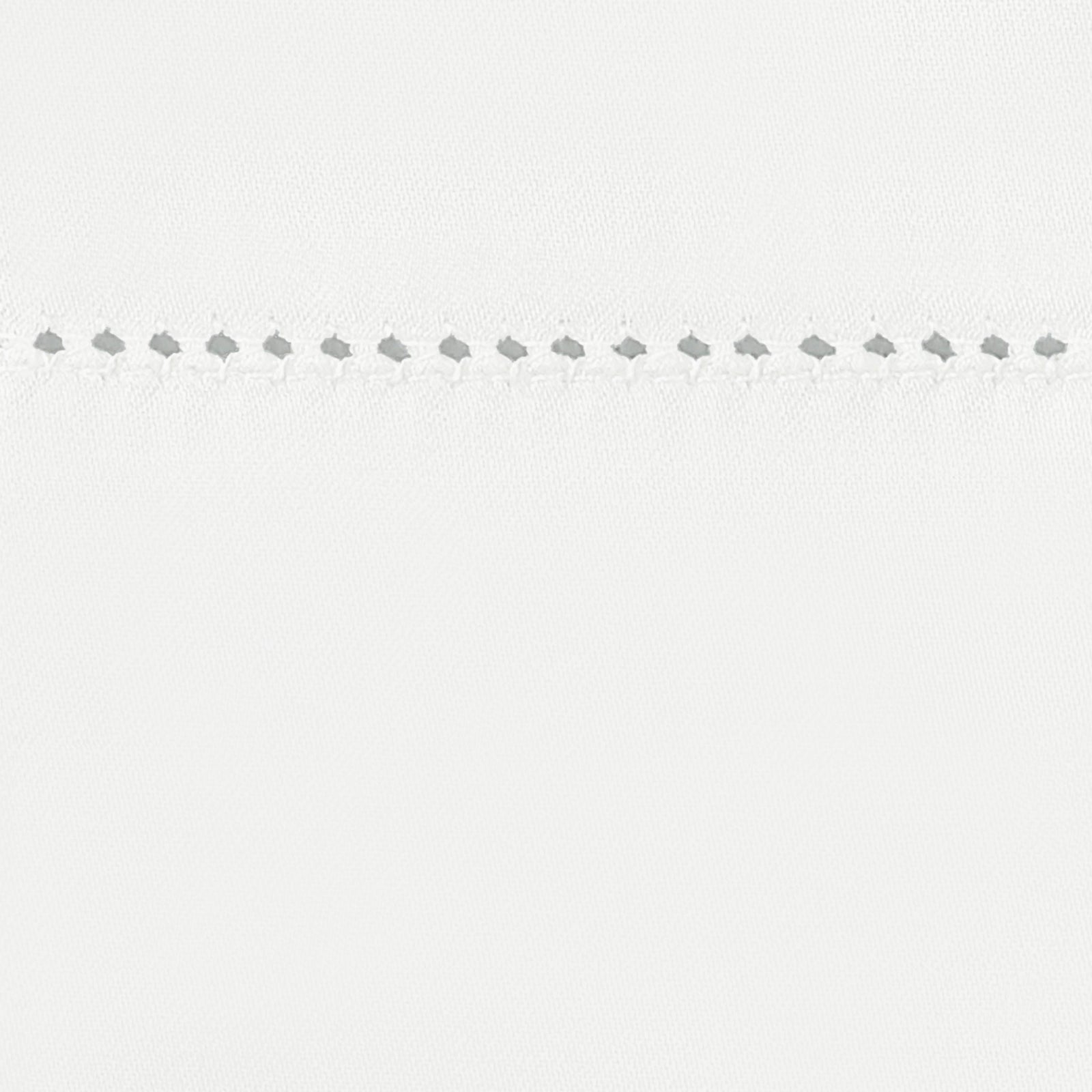 Stack of Matouk Milano Hemstitch Bedding in Different Colors