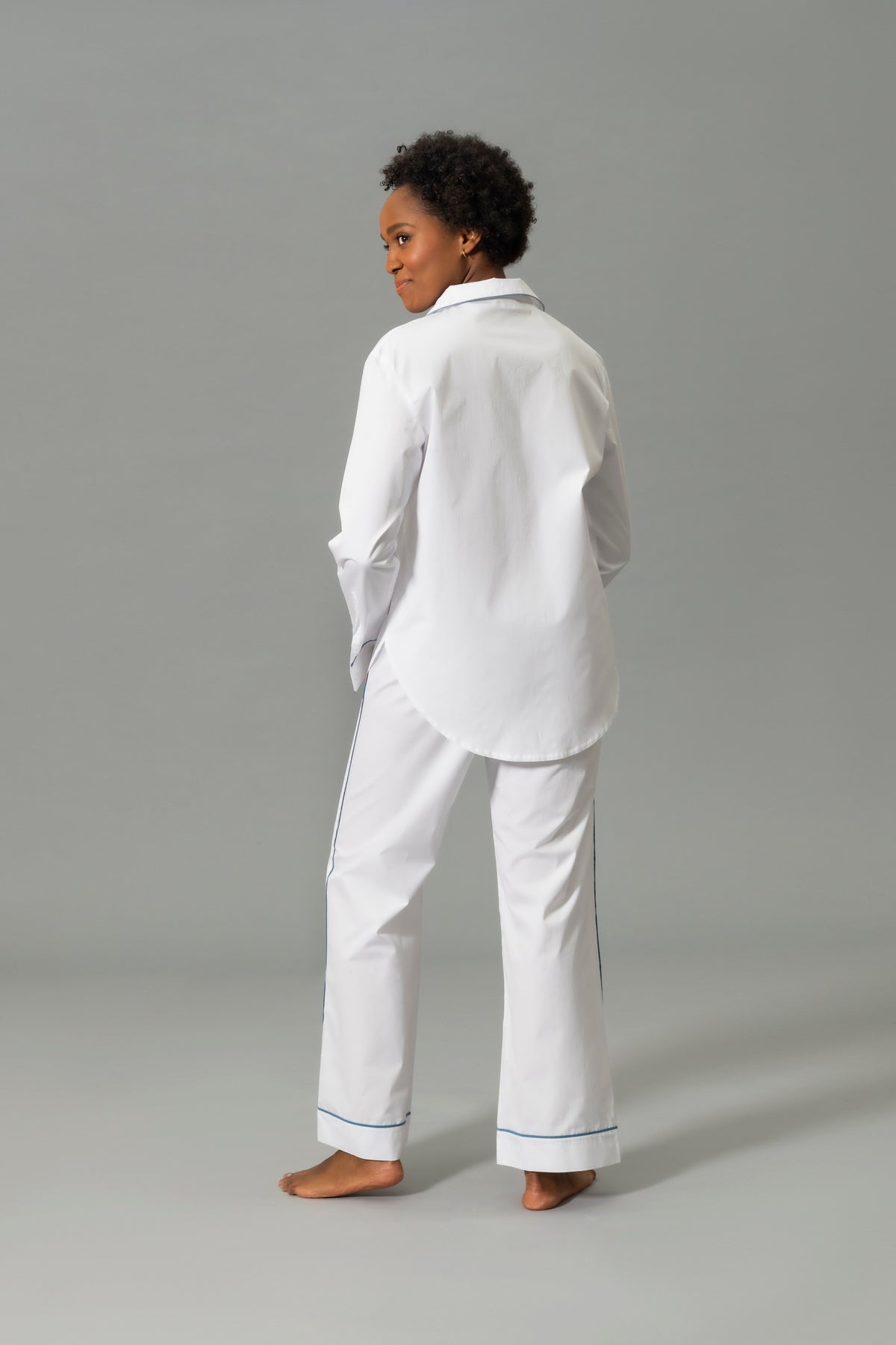 Back View of Model Wearing Matouk Milano Pajama Set in Color Sea