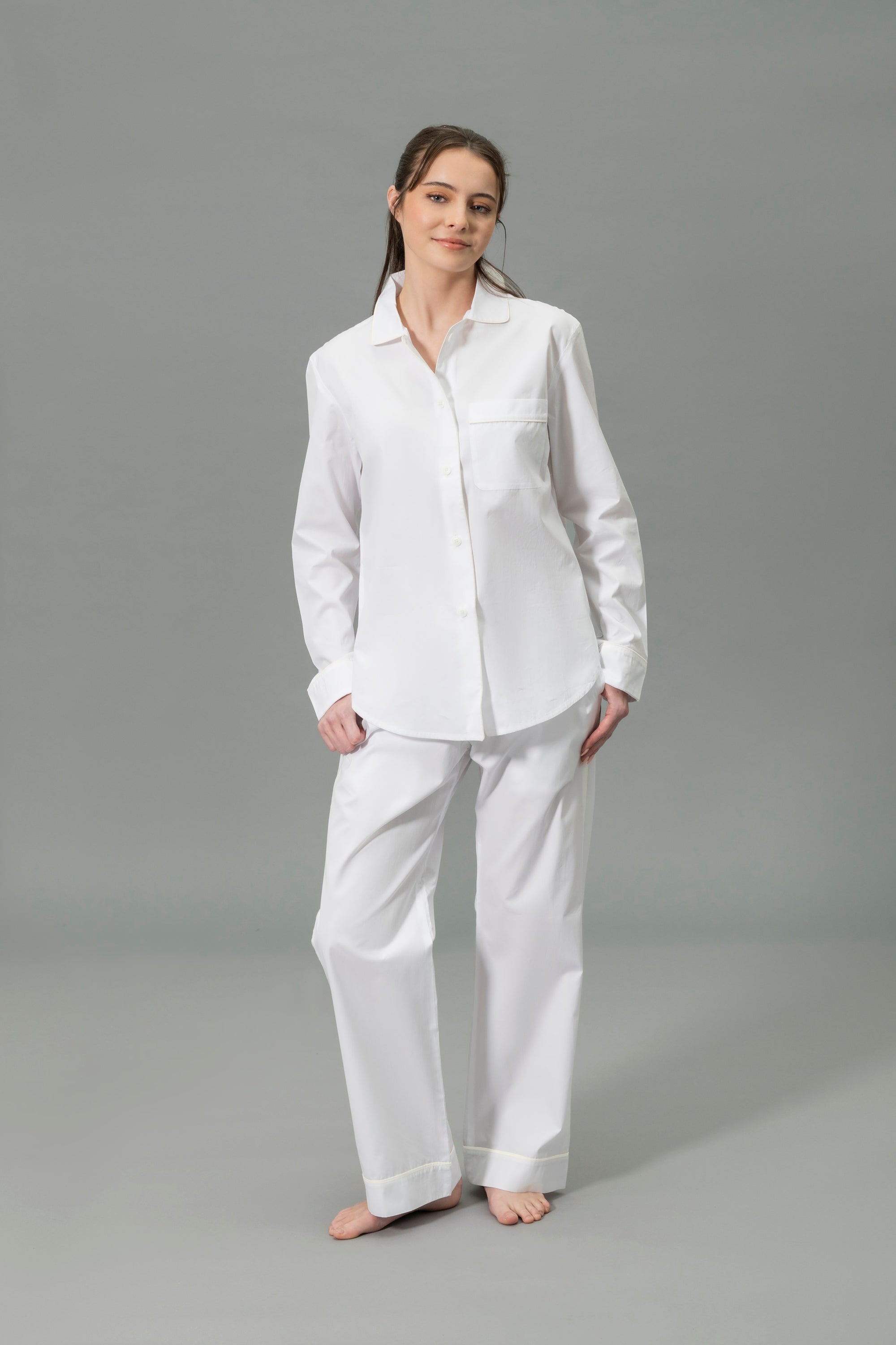 Front View of Model Wearing Matouk Milano Pajama Set in Color Ivory
