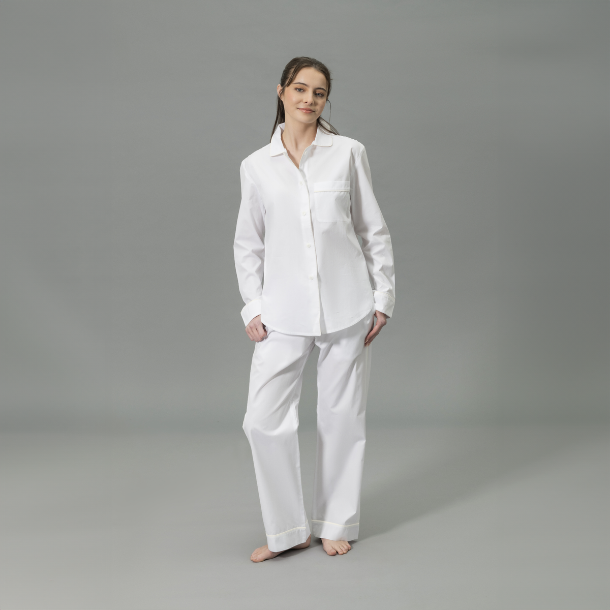 Front View of Model Wearing Matouk Milano Pajama Set in Color Ivory