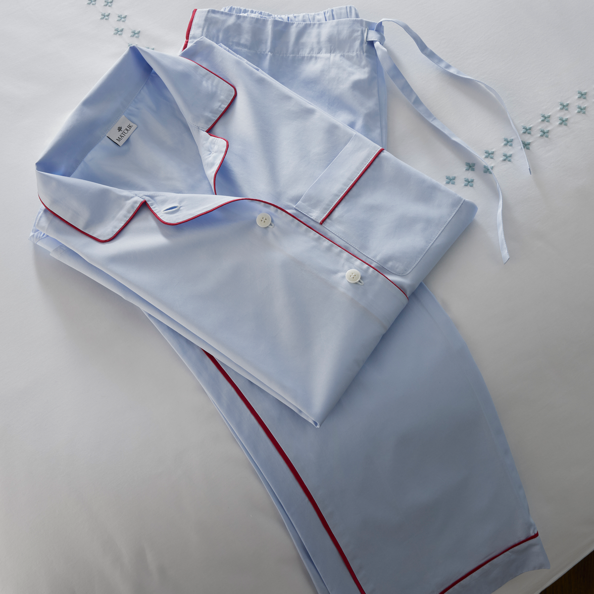 Folded Matouk Milano Pajama Set on Casablanca Bedding