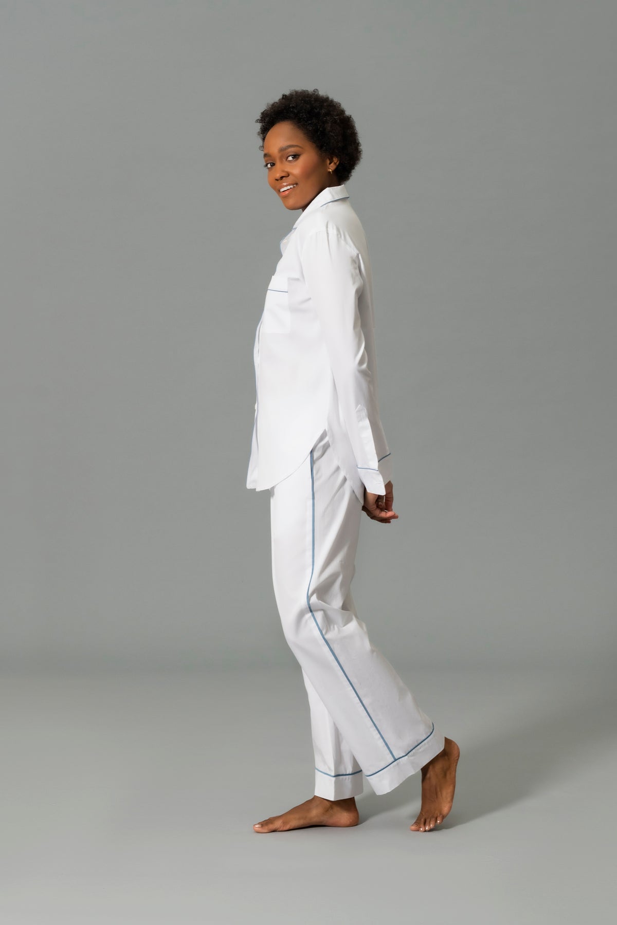 Side View of Model Wearing Matouk Milano Pajama Set in Color Sea