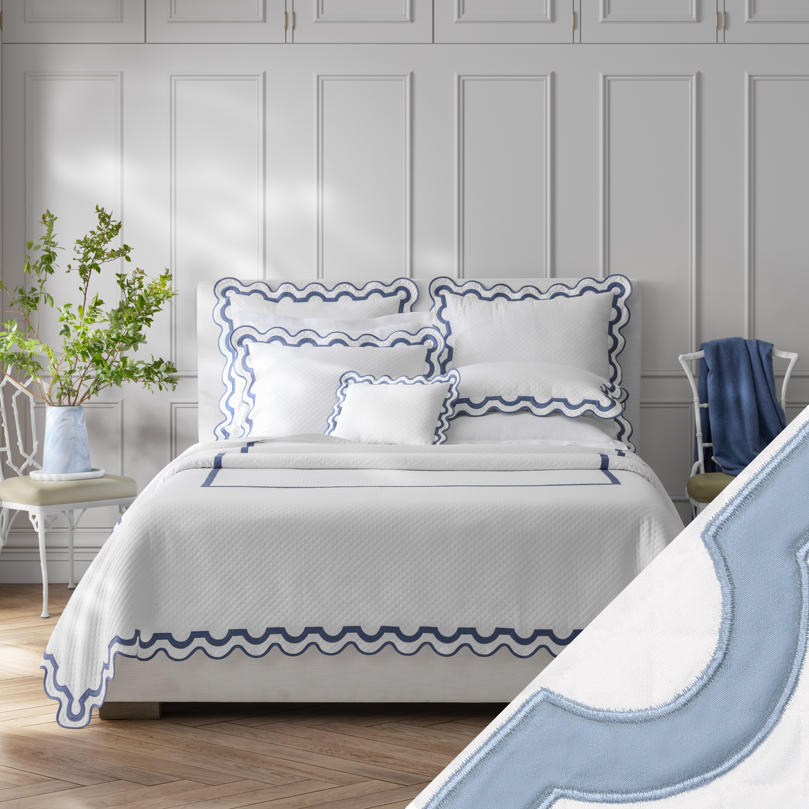 Full Bed Dressed in Matouk Mirasol Matelassé Bedding with Swatch in Hazy Blue