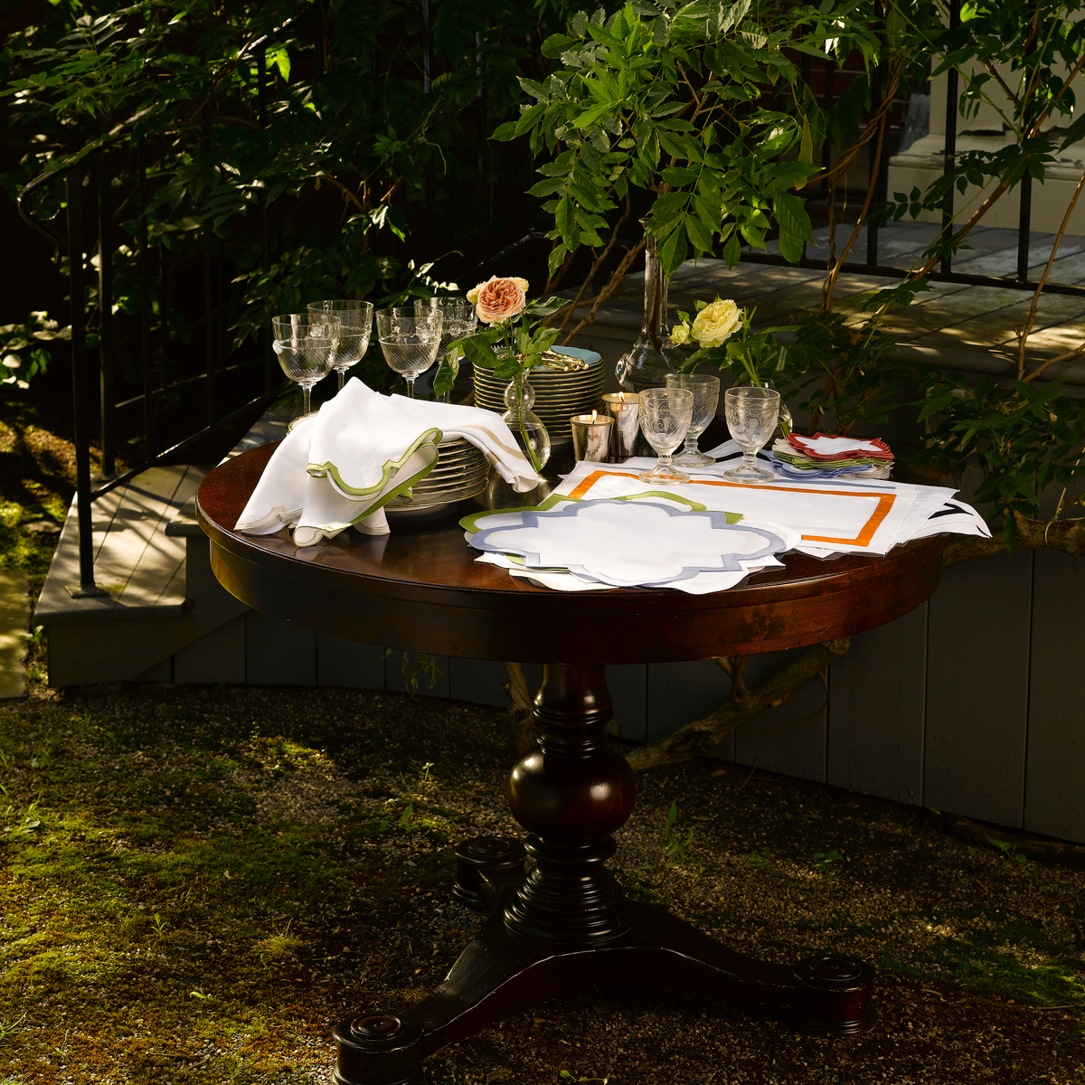 Lifestyle Shot of Matouk Mirasol Table Linens in a Garden
