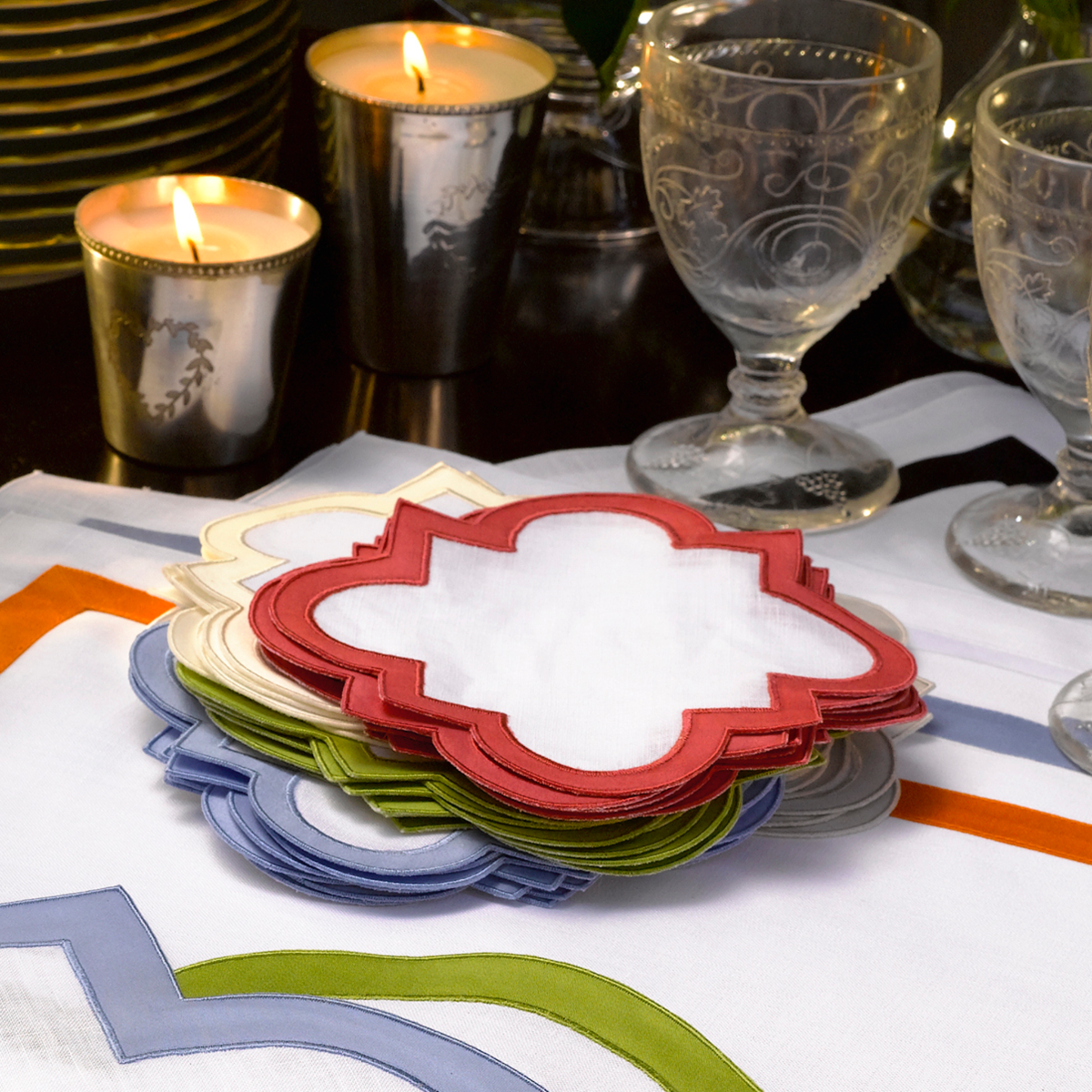 Stack of Different Colored Matouk Mirasol Table Placemats