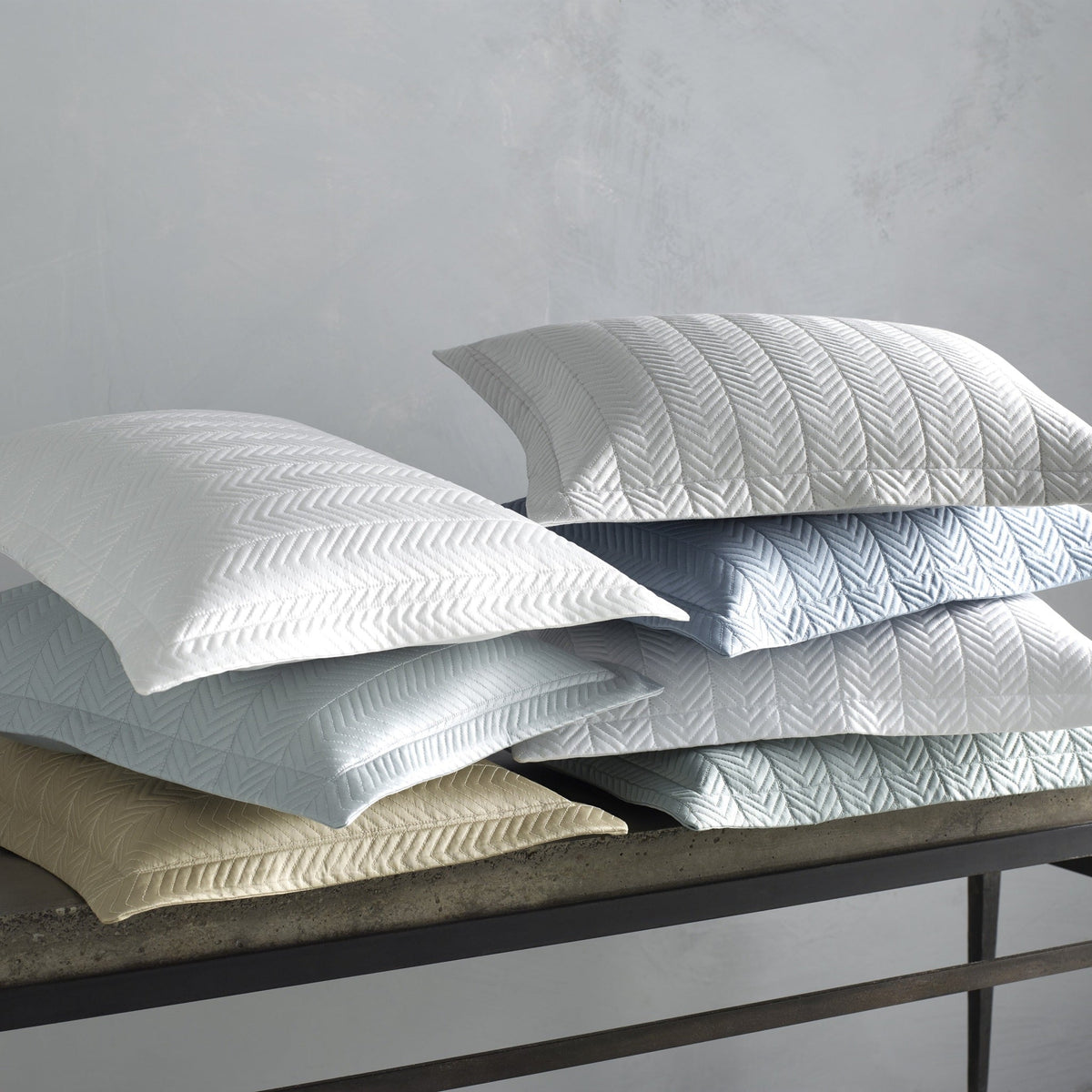Stack of Matouk Netto Bedding in Different Colors