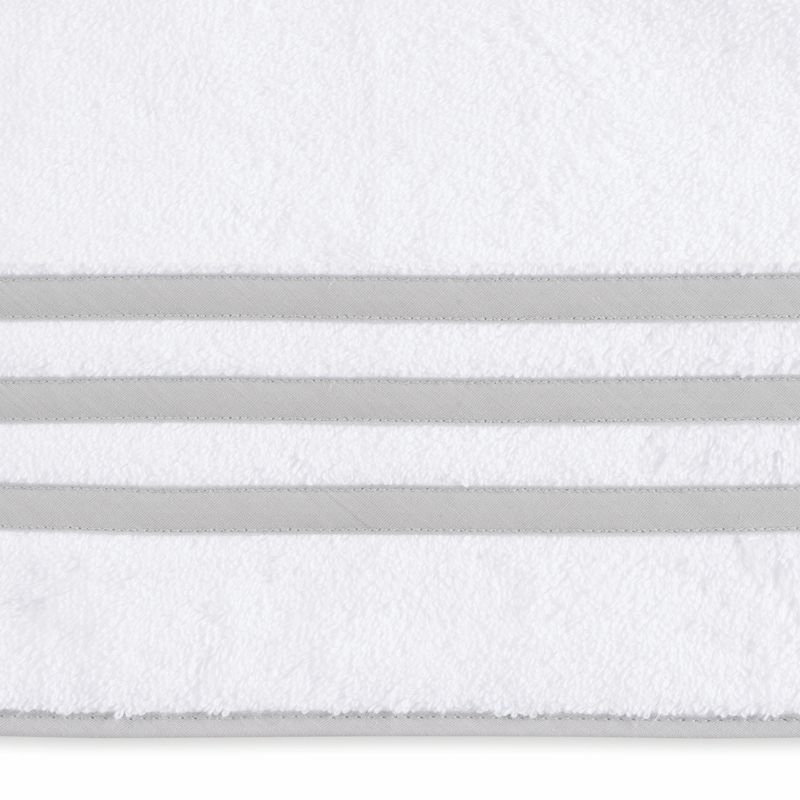 Lifestyle Image Showing All Colors of Matouk Newport Bath Towels and Mat