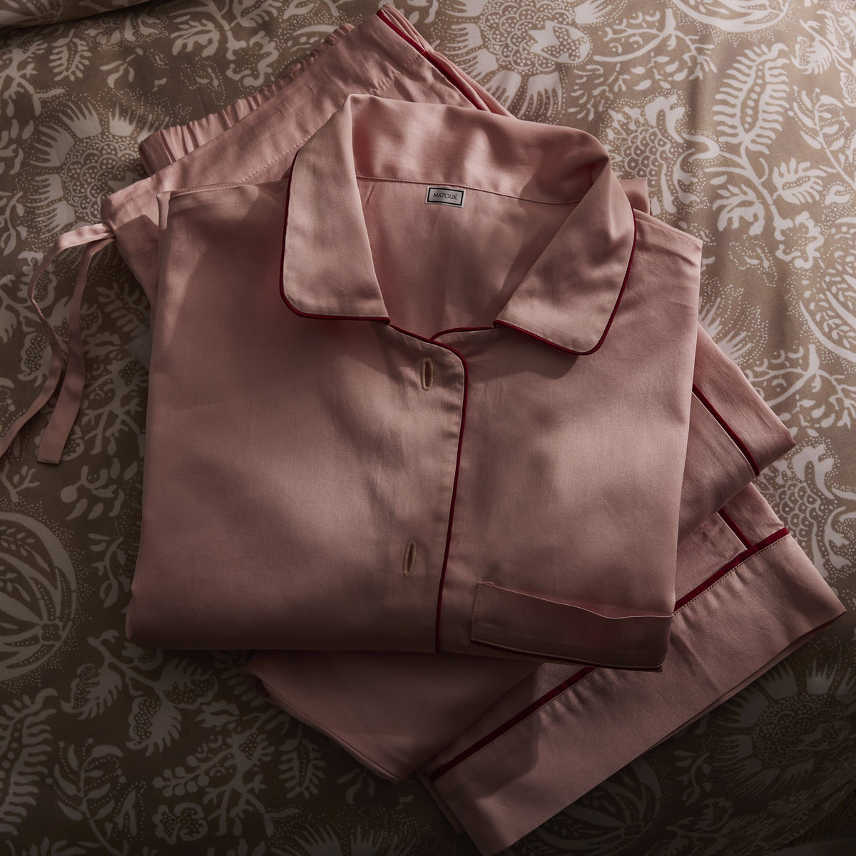 Detail Shot of Matouk Nocturne Pajama Set in Pink and Scarlet Color