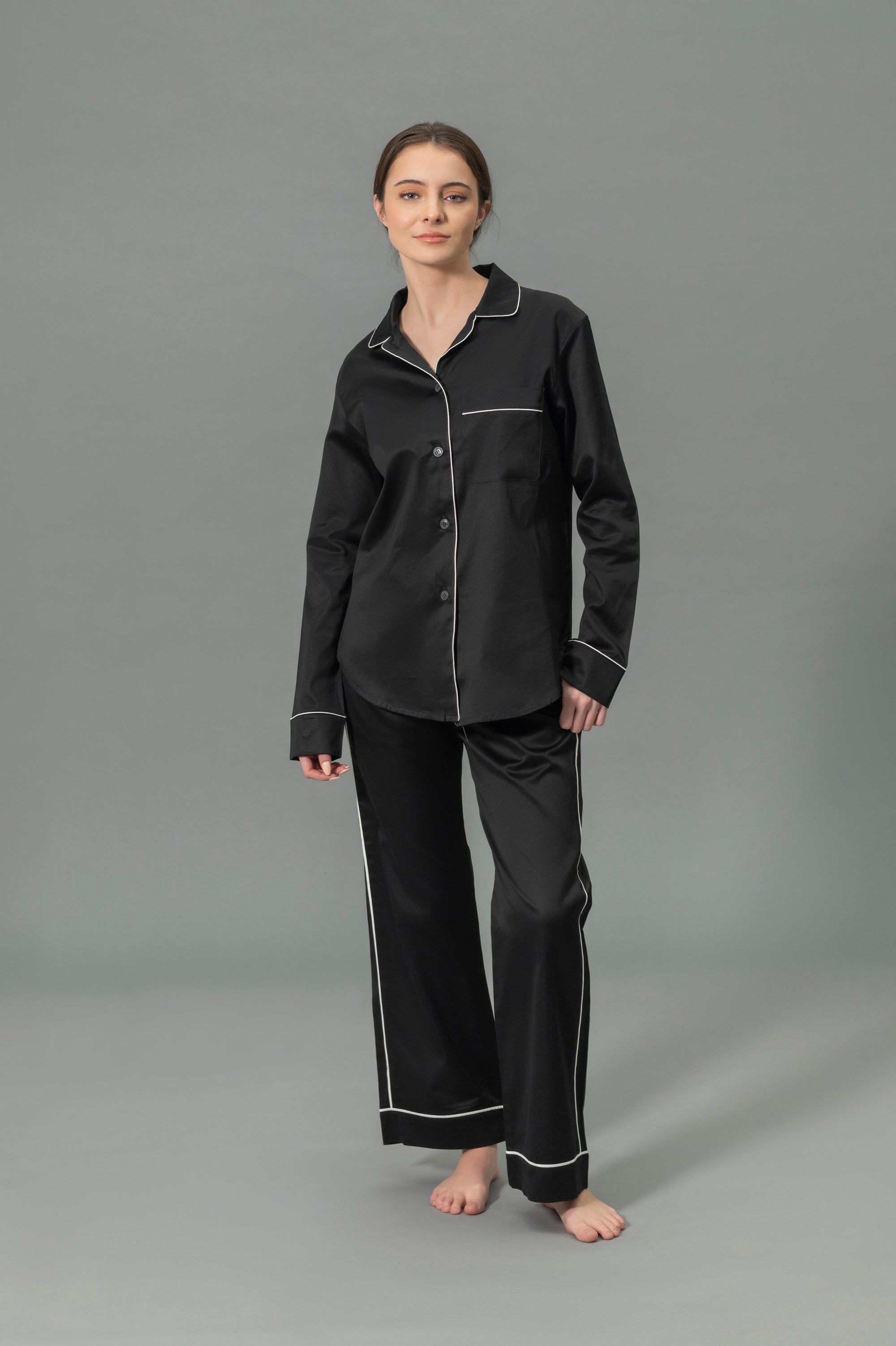 Front View of Model Wearing Matouk Nocturne Pajama Set in Color Black and Bone