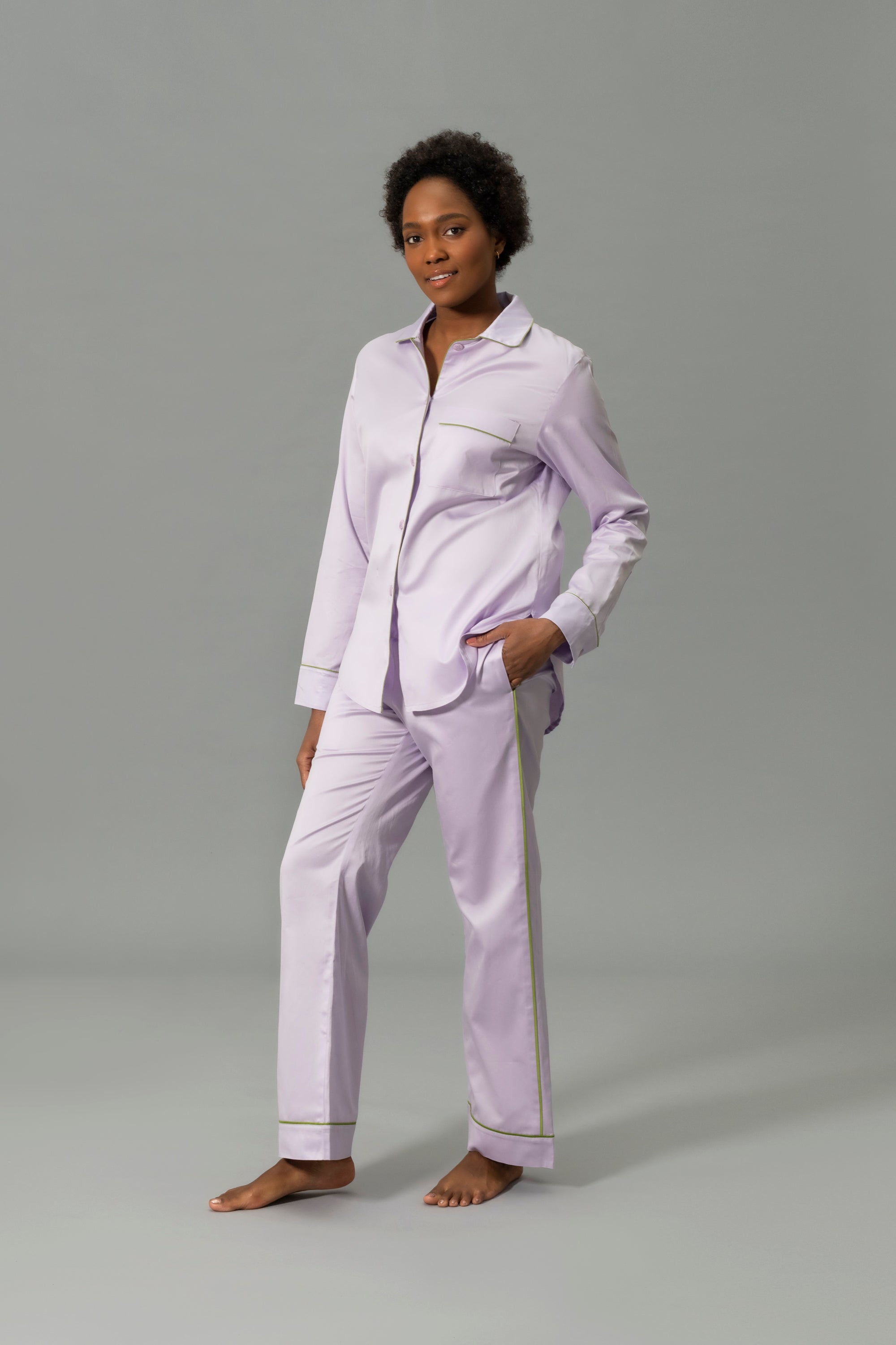Front View of Model Wearing Matouk Nocturne Pajama Set in Color Violet and Grass