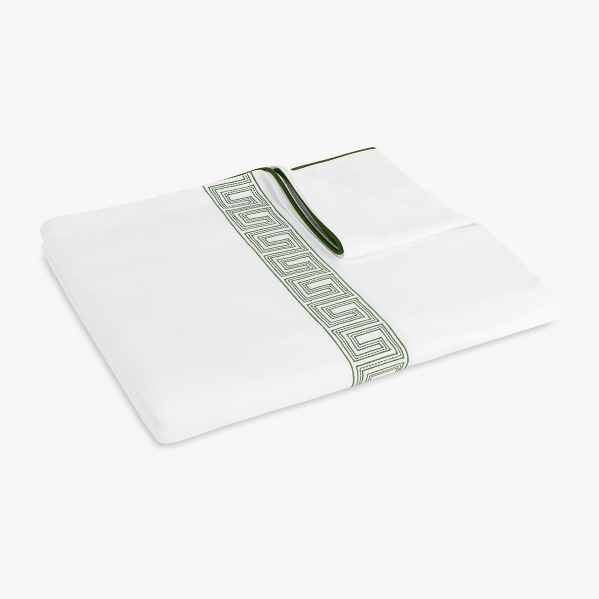 Folded Coverlet of Matouk Ophelia Pique Bedding in Clover