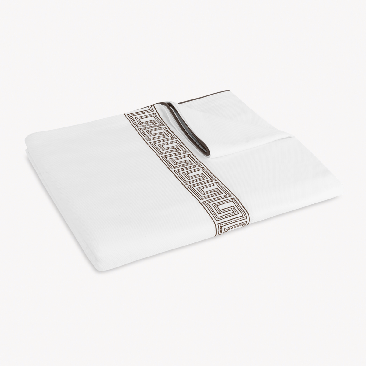 Folded Coverlet of Matouk Ophelia Pique Bedding in Mocha