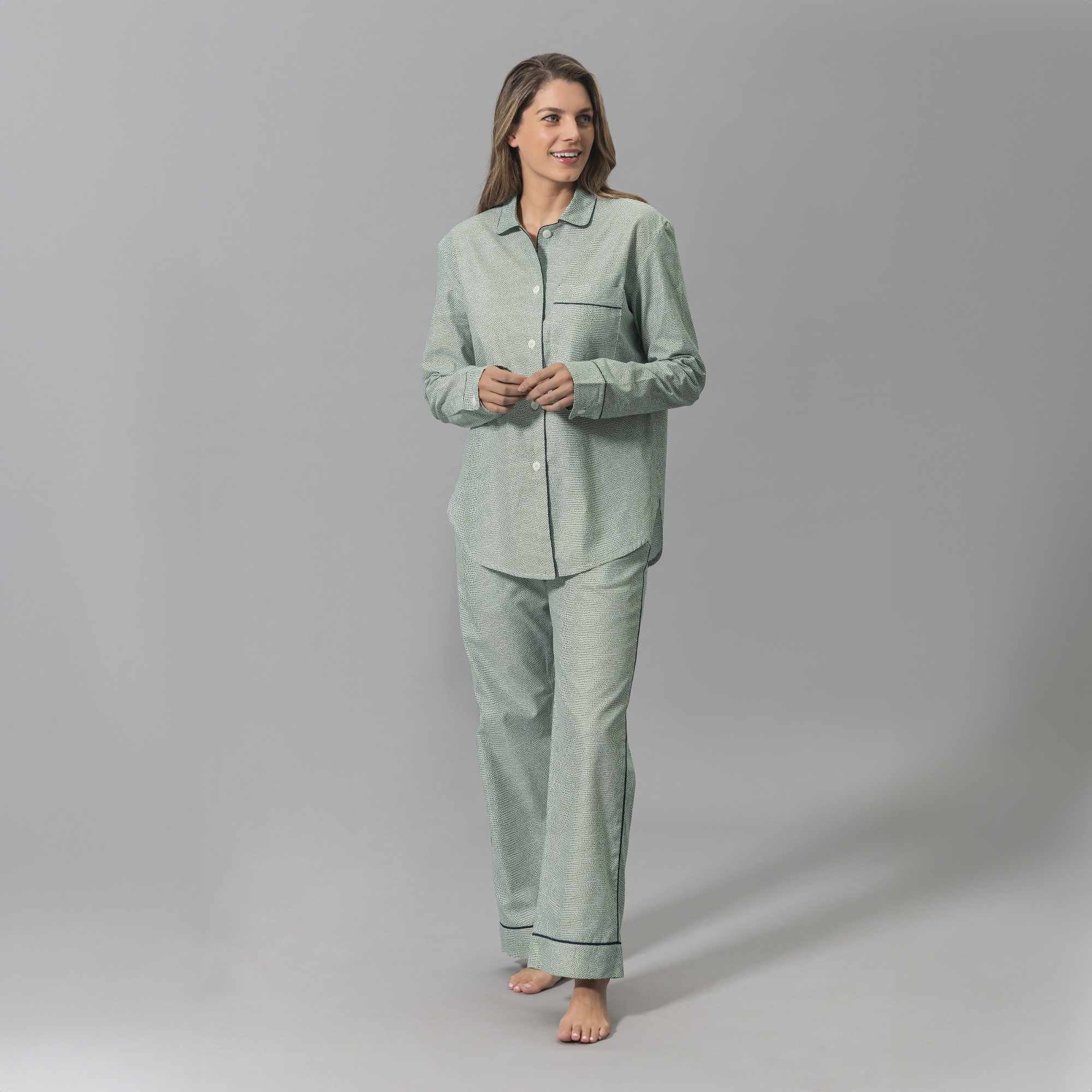 Woman Wearing a Matouk Jasper Pajama Set in Green and Navy Color