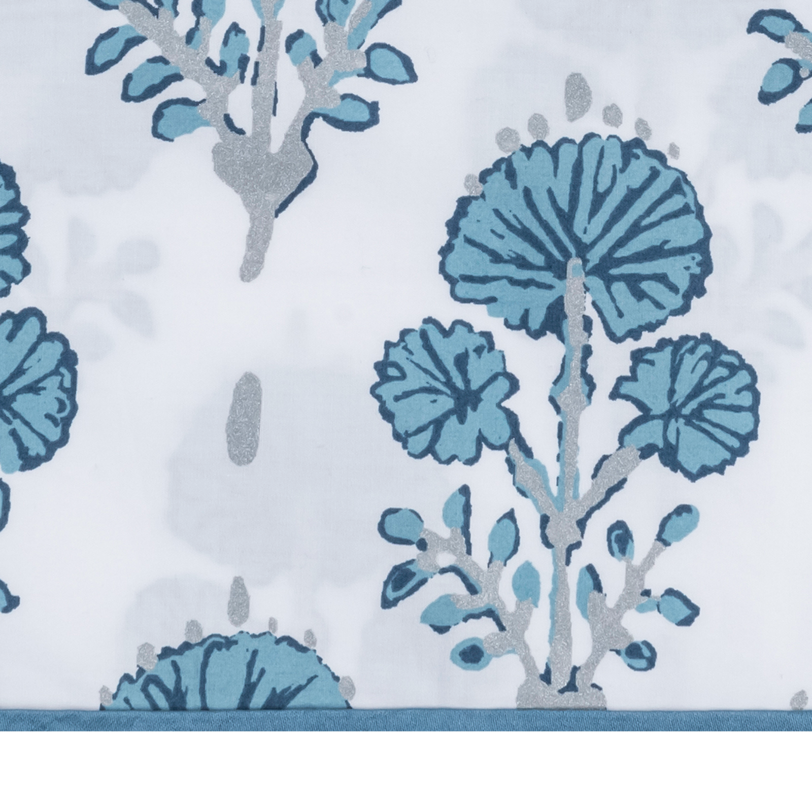 Woman Wearing a Lulu DK Matouk Joplin Pajama Set in Mineral Blue