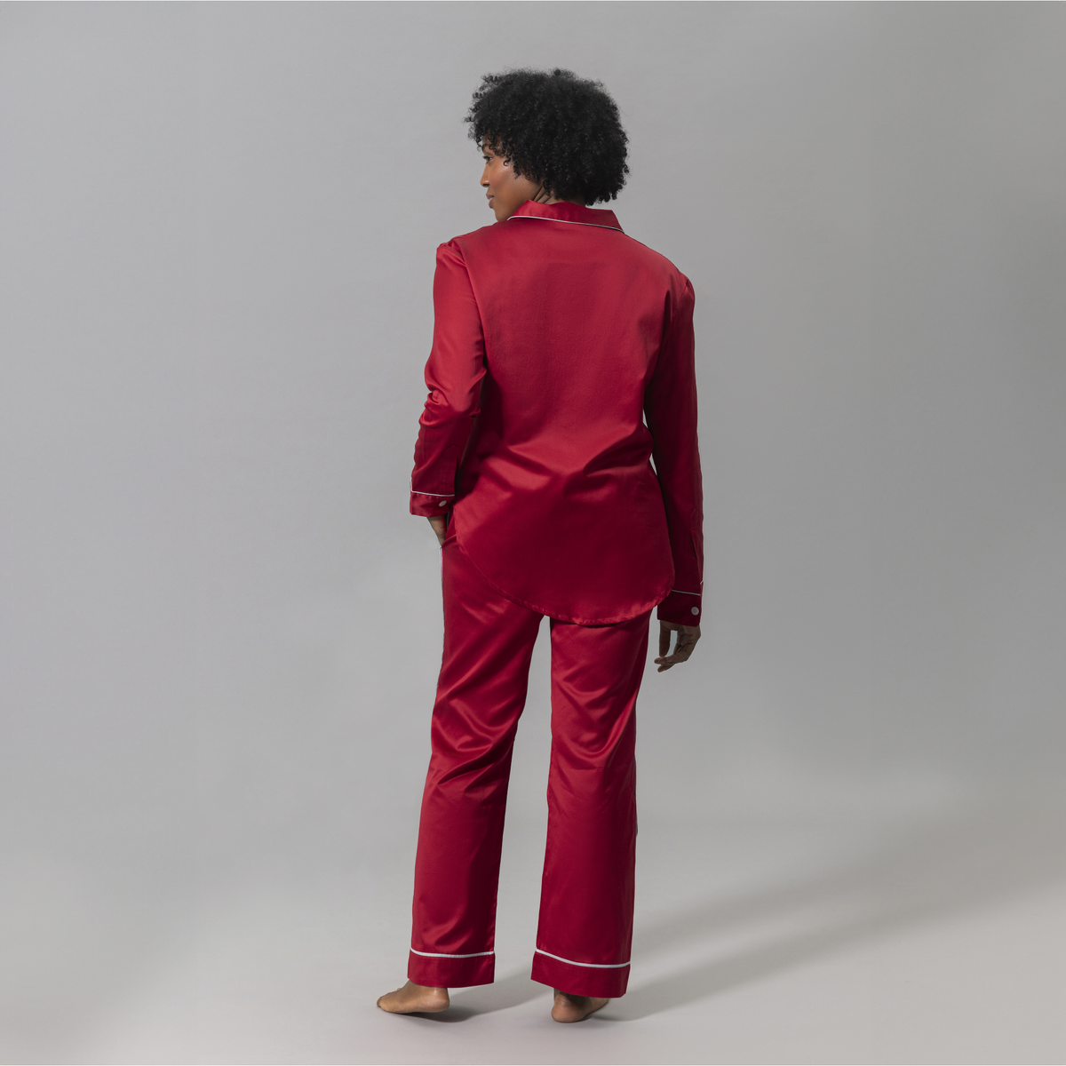 Behind View of Woman Wearing a Matouk Nocturne Pajama Set in Scarlet and Blue