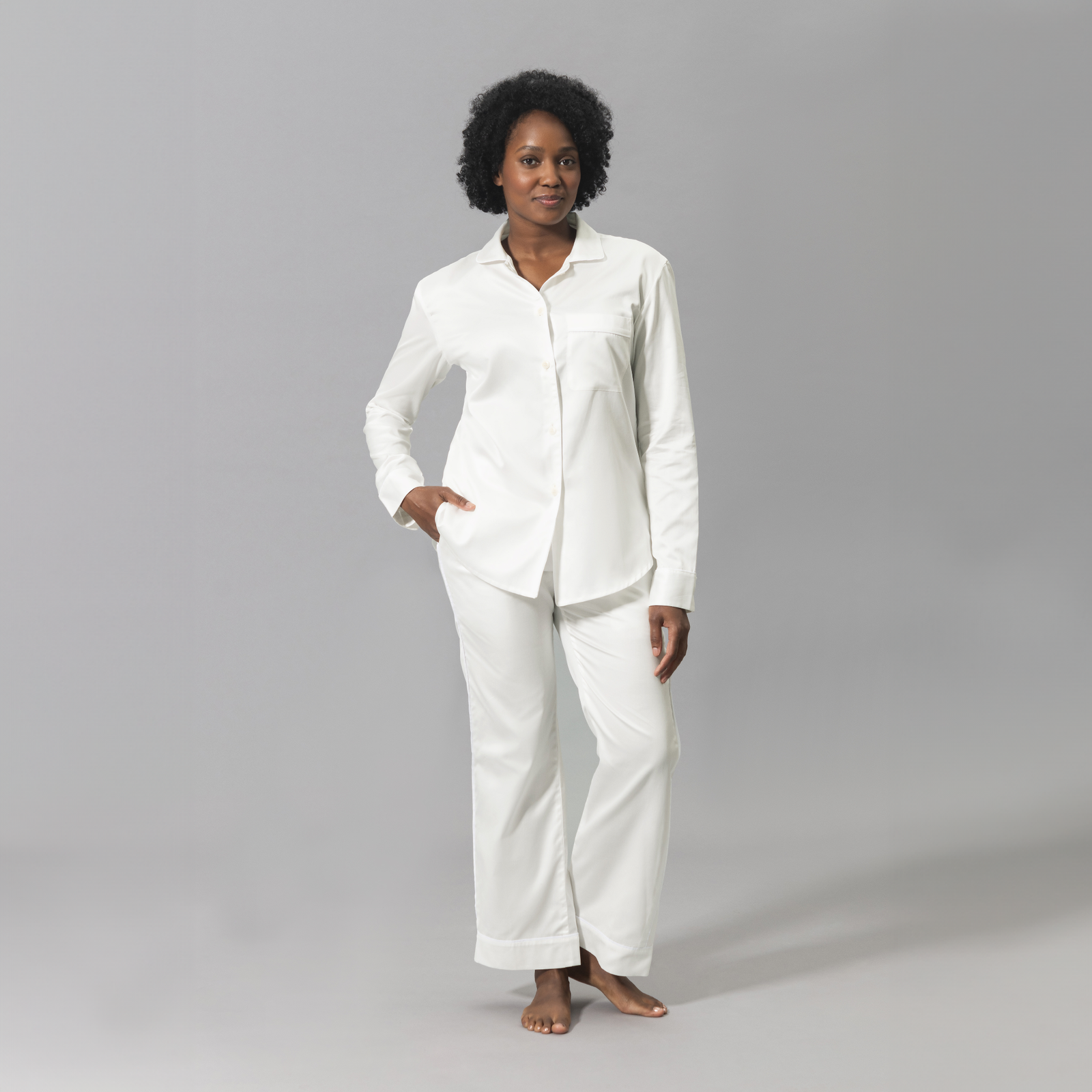 Woman Wearing a Matouk Nocturne Pajama Set in Bone and White