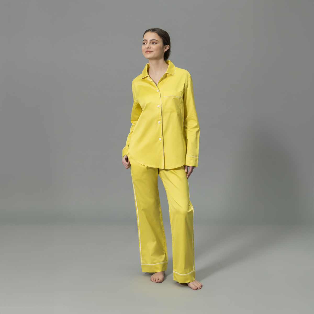 Front View of Model Wearing Matouk Nocturne Pajama Set in Color Lemon and Bone