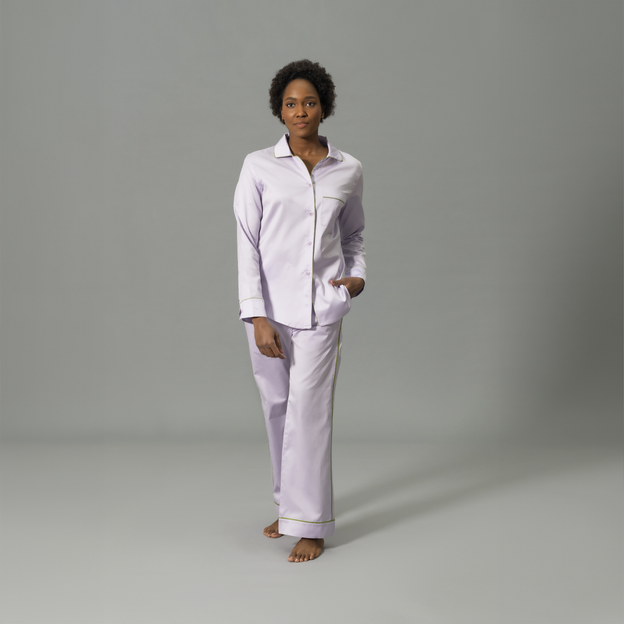 Front View of Model Wearing Matouk Nocturne Pajama Set in Color Violet and Grass