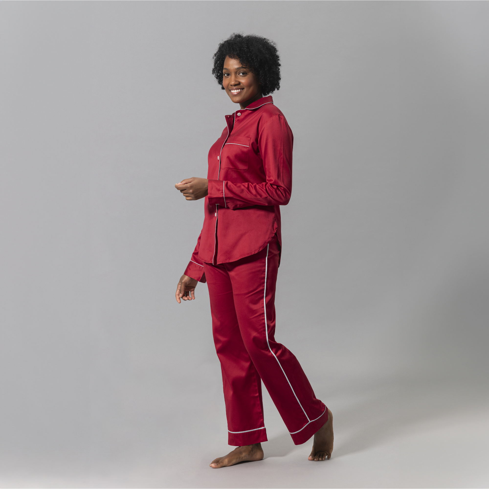 Woman Wearing a Matouk Nocturne Pajama Set in Scarlet and Blue