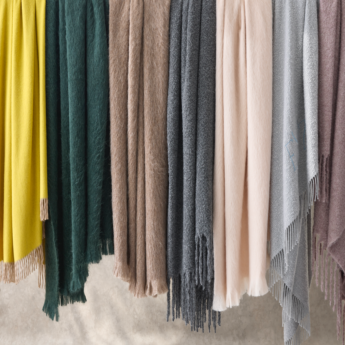 Hanging Matouk Paley Throws in All Colors