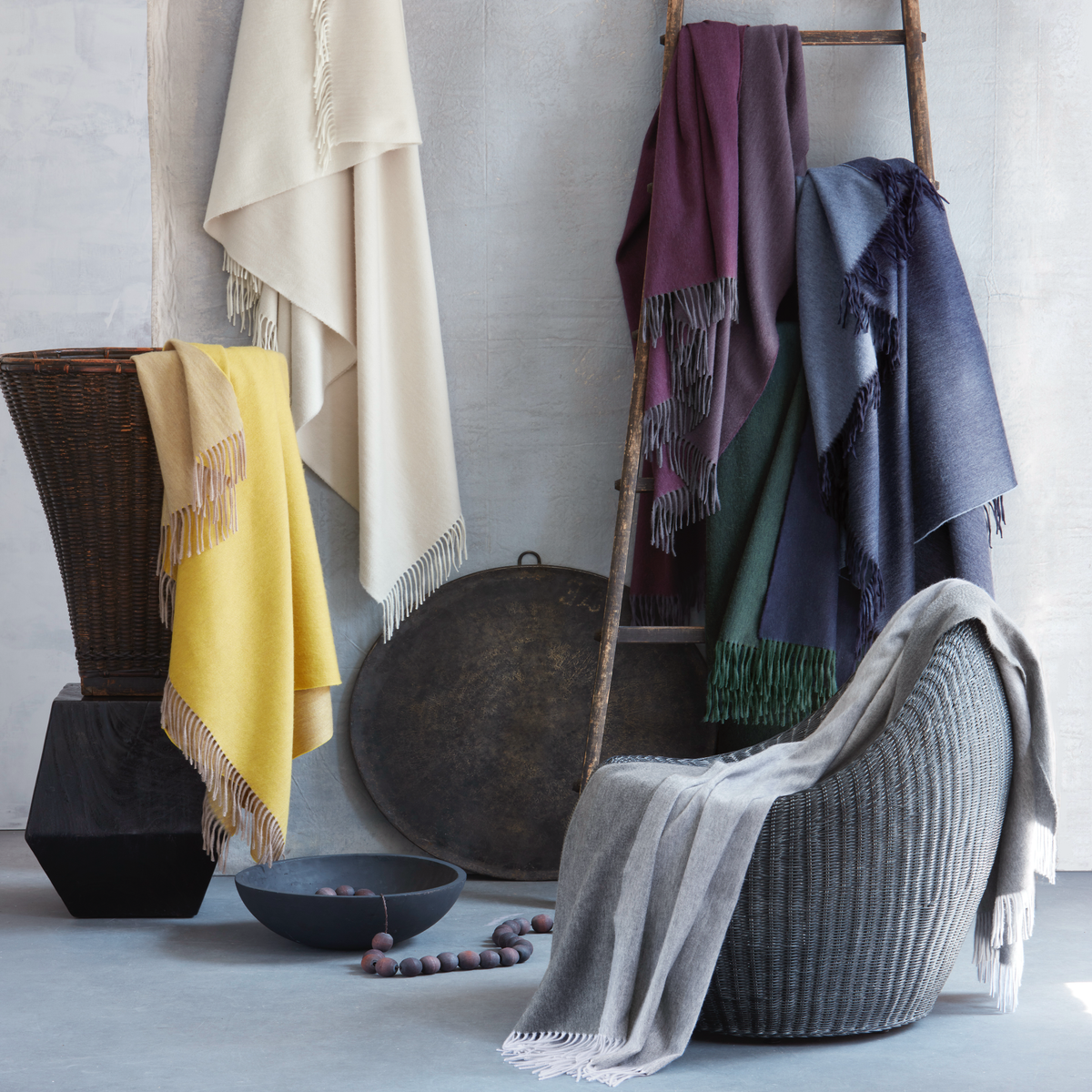 Lifestyle Image of All Colors of Matouk Paley Throws Collection