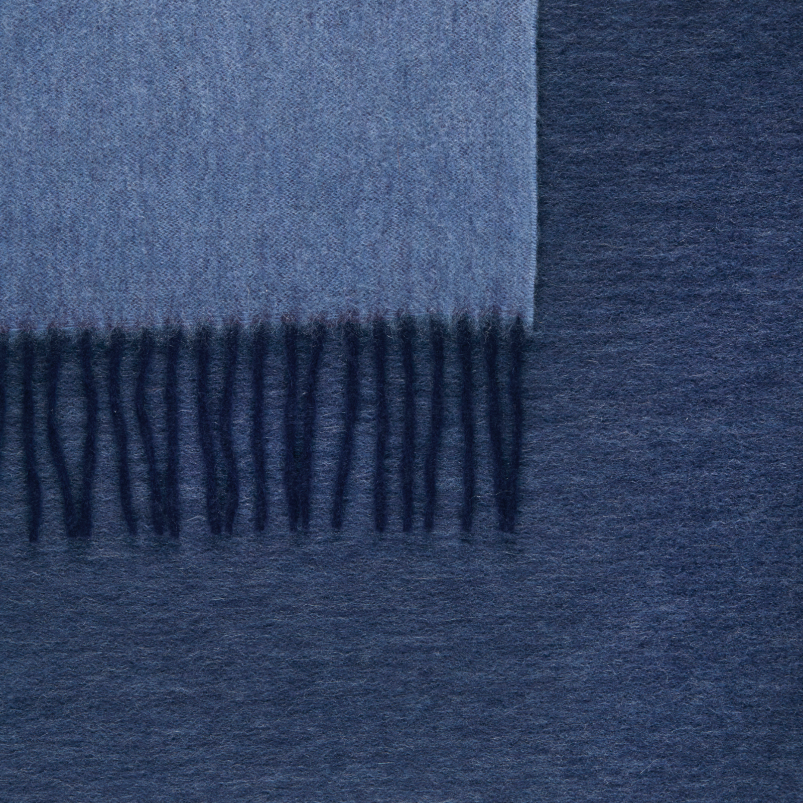 Folded Matouk Paley Throws in Navy and Chambray Color