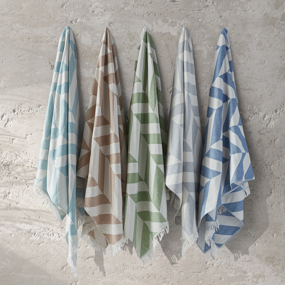 Matouk Paros Beach Towels in All Colors Hanging on the Wall