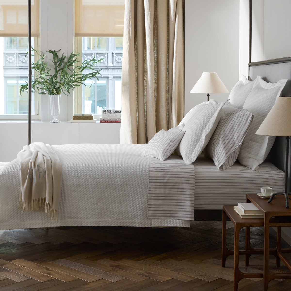 Bed in White Matouk Perla Bedding with Calypso in Pebble