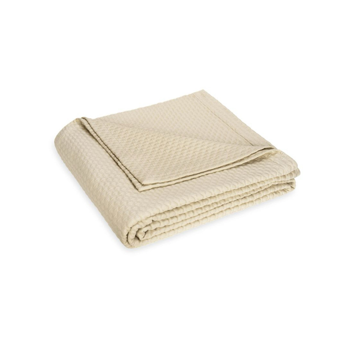 A neatly folded beige blanket with a waffle pattern, crafted from 100% cotton, shown on a plain white background.