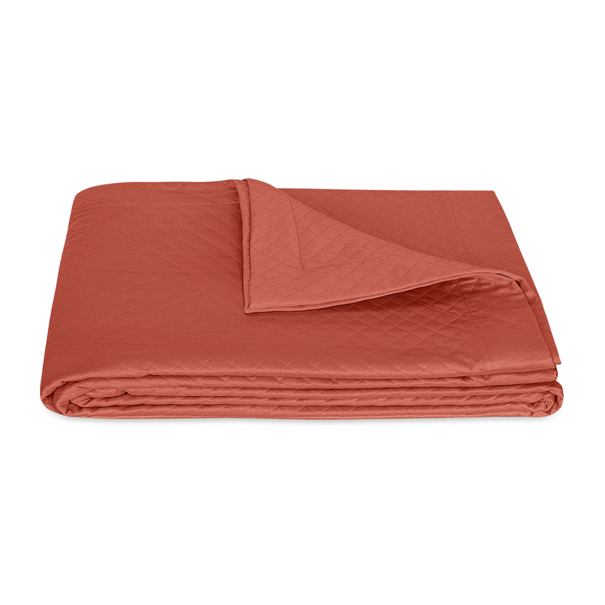 Folded Coverlet of Matouk Petra Bedding in Color Deep Coral
