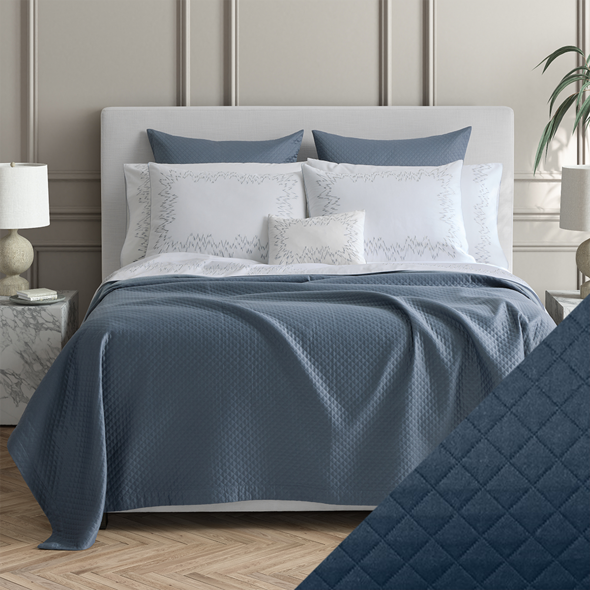 Bed Dressed in Matouk Petra Bedding with Swatch in Color Prussian Blue