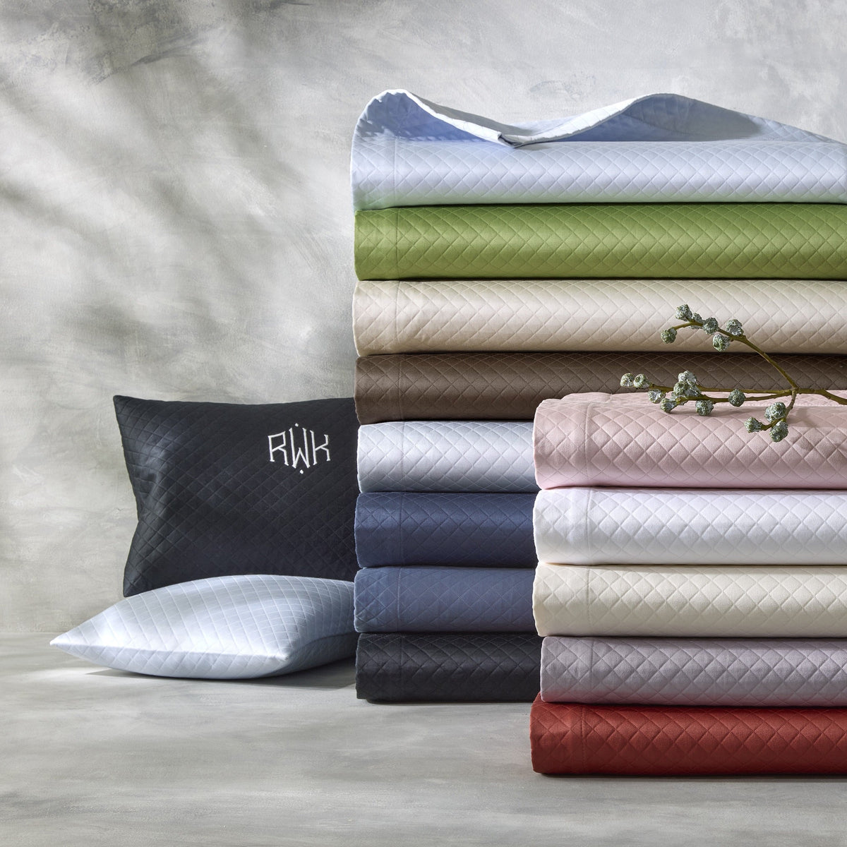 Stack of Matouk Petra Bedding in All Colors